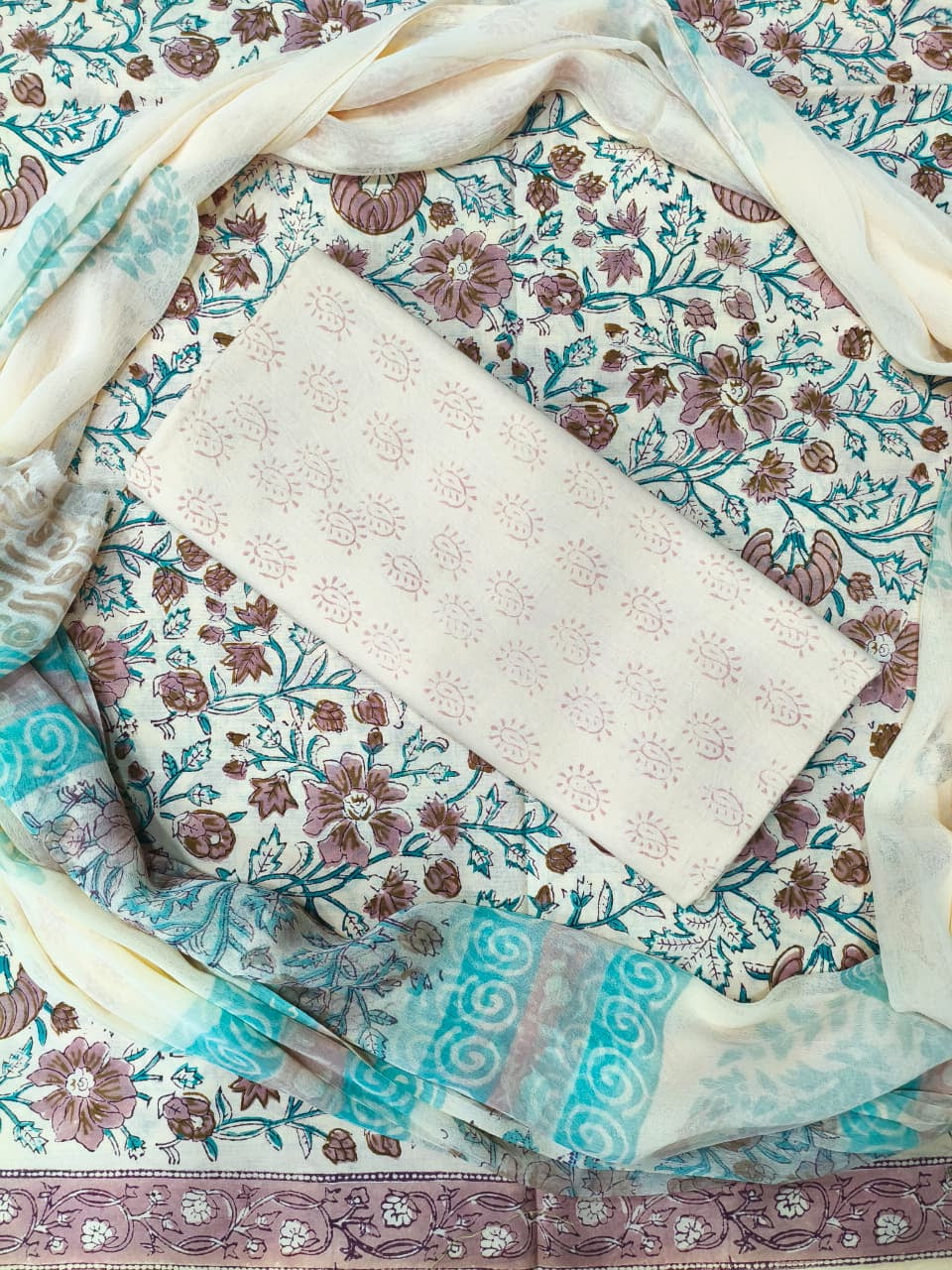 Collection of patterned fabric swatches in various colors and designs.